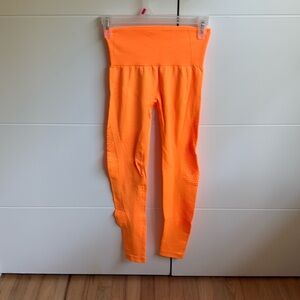 Neon orange leggins size XS 

Workout clothes